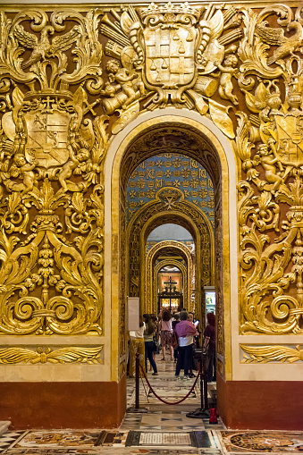 Valletta; Malta - 17 June 2023: Gold decorated arches spanning the side aisles in Valletta Cathedral; Malta