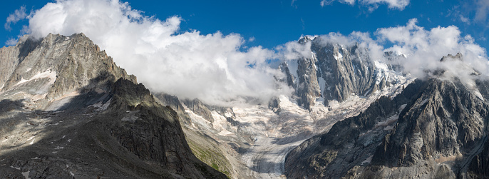 The panorama of Grand Jorasses massif and Glacier de Leschaux in the sunset light.