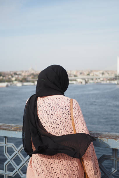istock Unhappy girl standing at bench . 2150150527