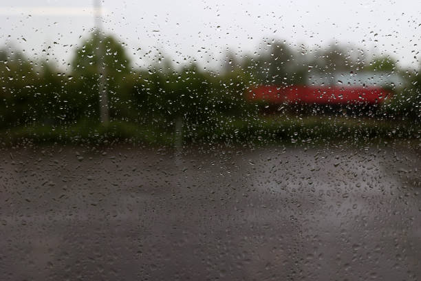 Rainy weather. Raindrops on the window glass.