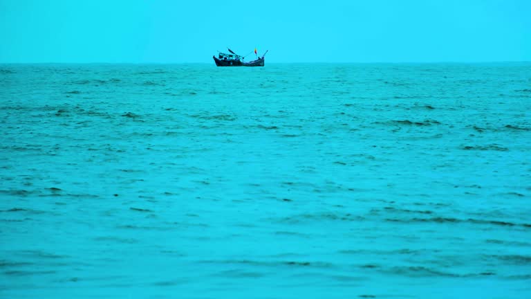 A View Of Floating Fishing Trawler Boat In The Indian Ocean. Static Shot