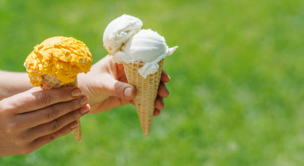 Refreshing ice cream in waffle cones with lemon flavour