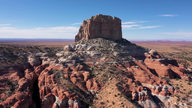 Aerial Flying Near Monument Butte Stone Massive Of Red Beige Rock In Desert Usa