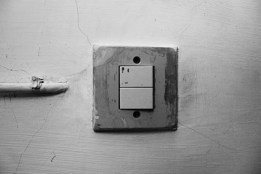 a old doorbell on a house wall