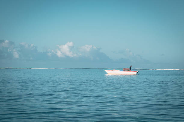 Fisherman on his small boat in the Indian Ocean