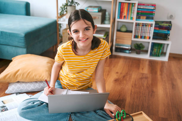 istock Studying from home. Girl is Working on Homework for School. Education Concept 2150156776