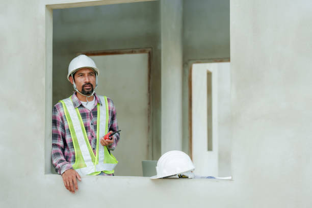 istock Asian man construction engineer, safety helmet, carrying radio device for communicating with technicians within construction zone, In order make coordination call that is not complicated. 2150160279