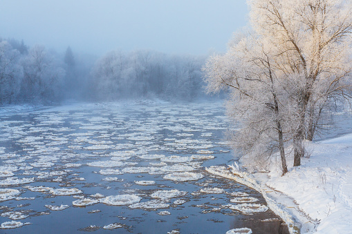 Winter landscape, amazing sundown in winter , Poland Europe, river valley Knyszyn Primeval Forest
