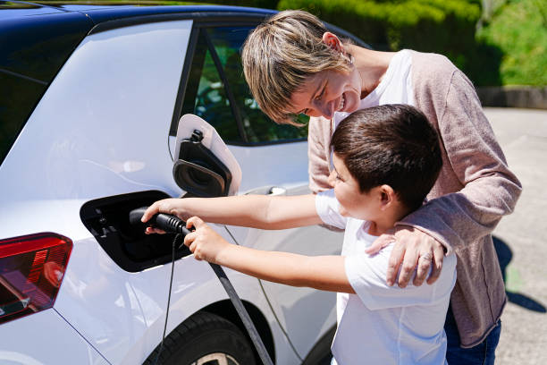 istock Mother and Son's Playful Collaboration at EV Charging Station 2150162784