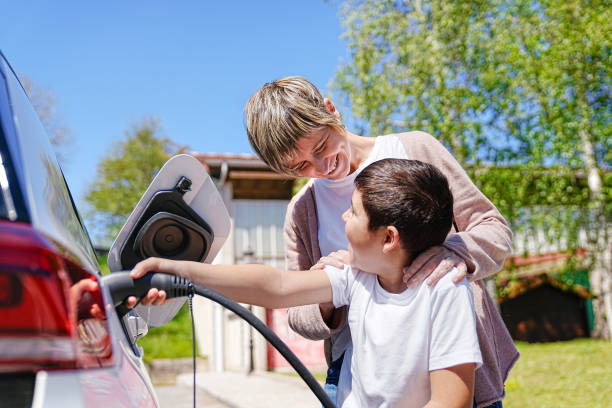istock Joyful Eco Learning Experience for Mother and Son at EV Charge 2150162849