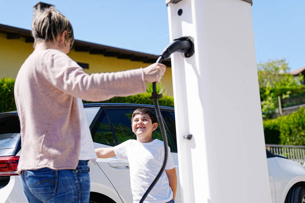 istock Mother and Son's Happy Moment at EV Charging Station 2150162898