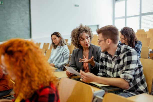 istock Mature Female Teacher Explaining Student in University College 2150162983
