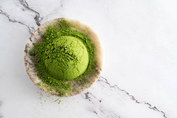 istock Matcha powder or young barley grass and chlorella spirulina. 2150163259