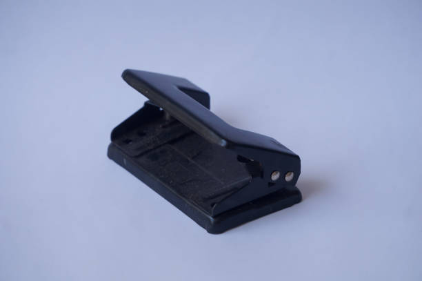 istock Black hole puncher isolated on white background 2150165212