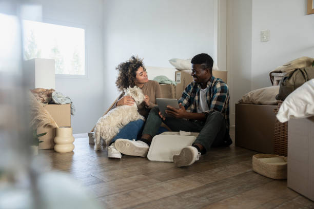 istock Young couple taking a break after moving into new apartment 2150166949
