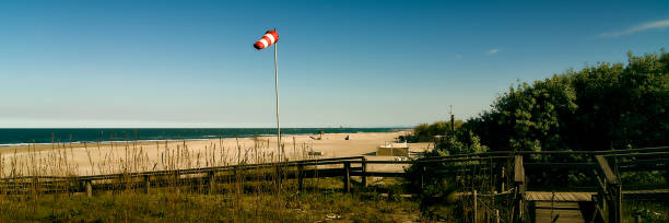 istock Wind sock (red and white) located in Punta Marina, Adriatic sea 2150167959