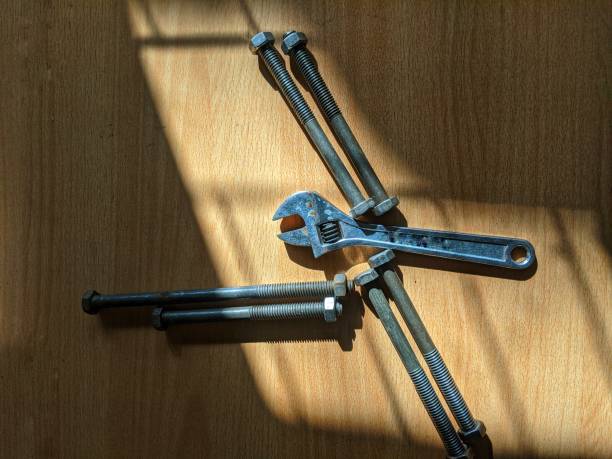 Large screws and supana wrench, craftsman's tools