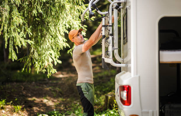 istock Camper Van RV Owner Preparing Bike Rack 2150168427