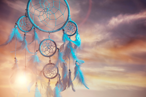 Dream catcher at sunset background with copy space