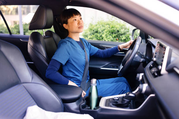 istock Japanese nurse driving her car 2150172460
