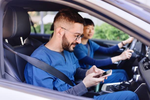 istock Medical workers driving in the car 2150172486