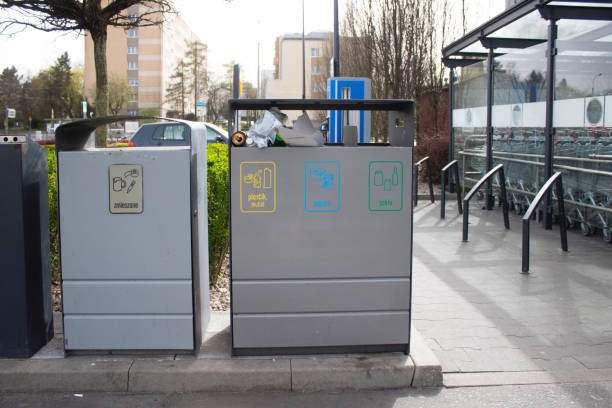 istock Public garbage bin with waste separation on a city street filled with garbage 2150175306