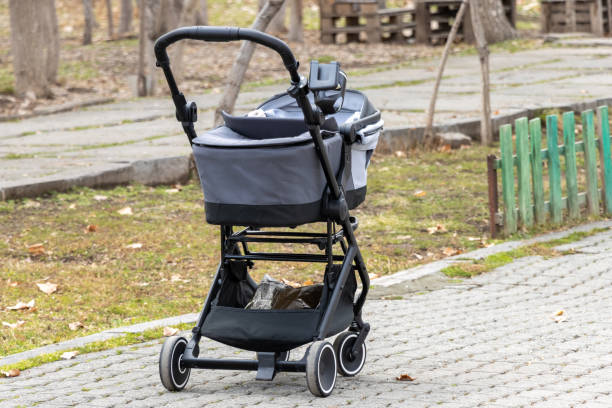 istock An empty black baby stroller in the park 2150176856