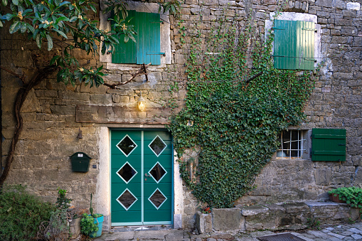 charming little village in Croatia called the istrian Toscana with stone walls and nice doors and windows .