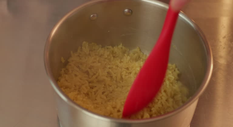 stirring boiled brown rice