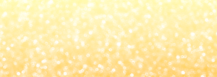 Yellow orange golden bokeh glitter background. Summer holiday backdrop. Celebration, New Year, Christmas and Joyful and Festival template panorama banner concepts.