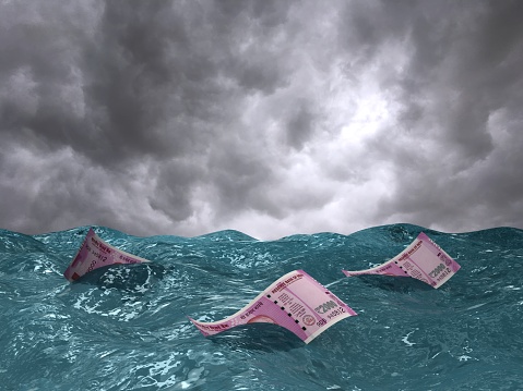 Indian rupee falling money financial crisis recession drowning sea