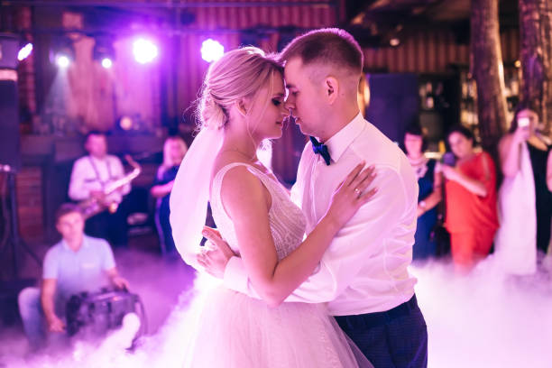 istock Happy beautiful newlyweds dancing in the restaurant. 2150187890