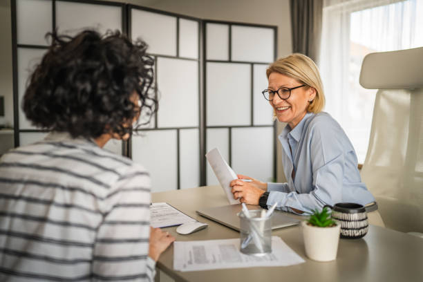istock Two female colleagues are consult about work at office 2150189322