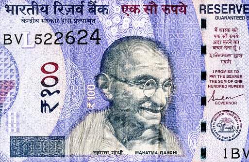 Mahatma Gandhi (1869-1948). Portrait from indian rupee banknote close up