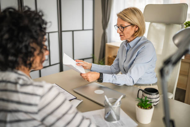 istock Two female colleagues are consult about work at office 2150189475