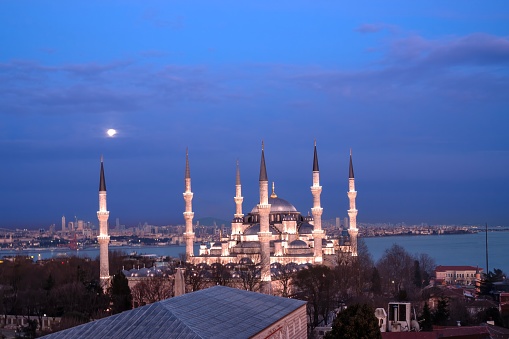 The blue Mosque rooftop view at dusk with moon in Istanbul - Turkey
