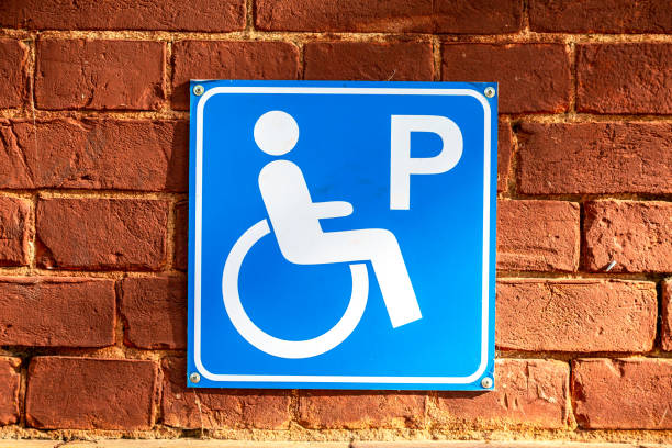 istock Disabled parking icon on the red brick wall 2150189703