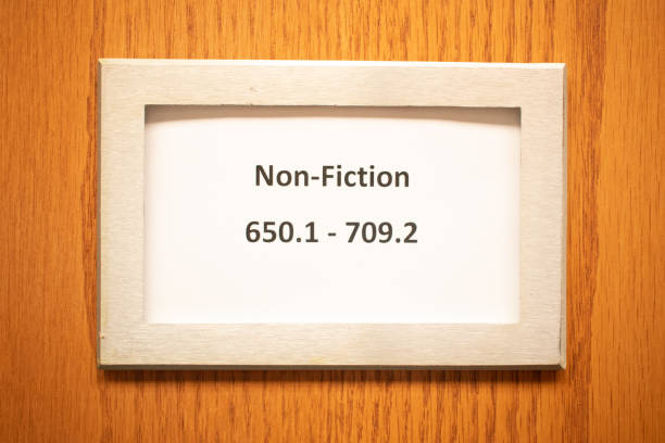 Library book aisle Dewey decimal system label for locating non-fiction books with ease
