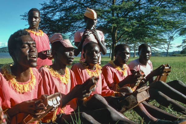 Kampala, Uganda - May 1975: Musicians playing akogos (thumb pianos), a traditional Ugandan instrument.