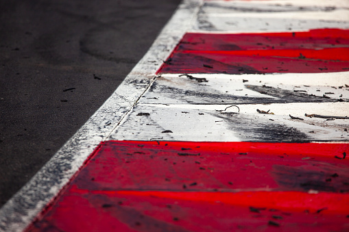 A concrete curb on a motorsports racetrack.