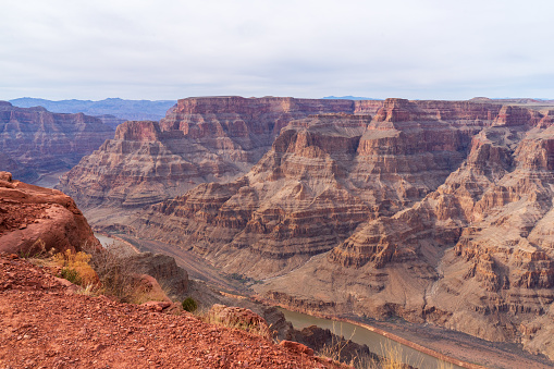 Breathtaking and spectacular view of rock formations and Colorado river at Grand Canyon West. One of the world heritage, a worldwide geological phenomenon known as the Great Unconformity of rock in which 250 million-year-old rock strata lie back-to-back with 1.2 billion-year-old rocks.