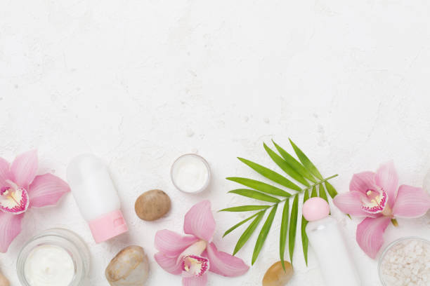 istock Composition with orchids, spa products on concrete background, top view 2150199644