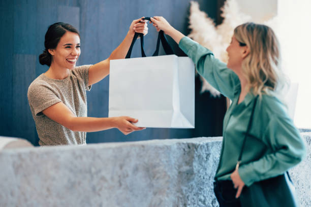 Friendly Exchange Between Women with a Shopping Bag