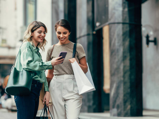 Two Young Women Sharing a Moment on Shopping Trip