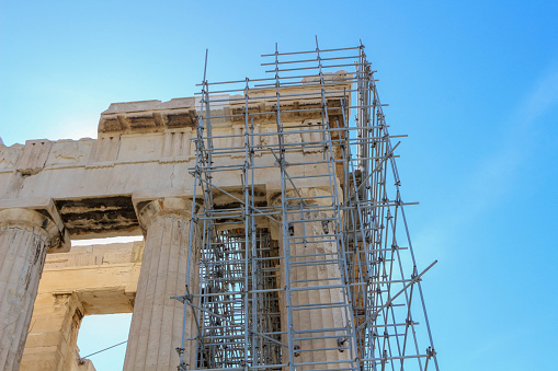 Witness the Parthenon's transformation amidst renovation, symbolizing the delicate balance between thwarted tourism expectations and the meticulous restoration of ancient art