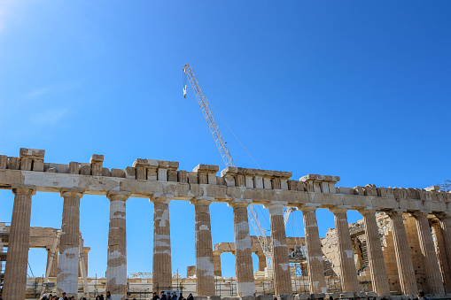 Witness the Parthenon's transformation amidst renovation, symbolizing the delicate balance between thwarted tourism expectations and the meticulous restoration of ancient art