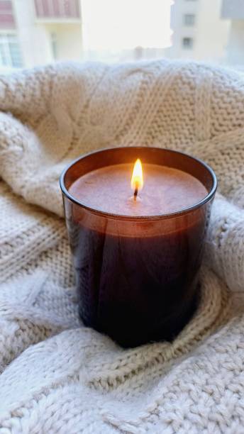 istock candle, extinguished candle, candle in jar 2150202754