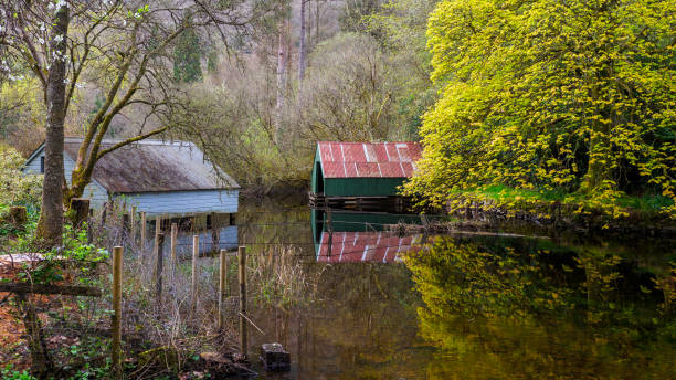 istock Boathouses reflected on Loch Ard, Scotland. 2150205398