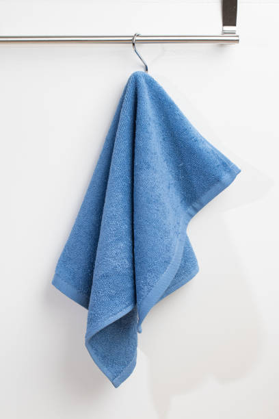 istock a terry towel hangs on a metal bracket attached to the wall 2150205444