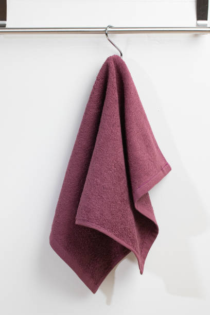 istock a terry towel hangs on a metal bracket attached to the wall 2150205506
